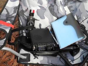 Operating position - FT-817 antenna tuner and wire antenna on a fold-up chair.